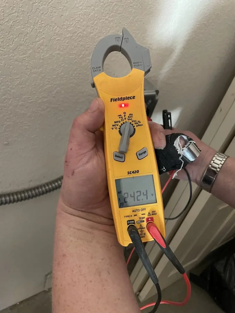 Voltage testing with clamp meter during Electrical Installation Services in Pleasant Valley